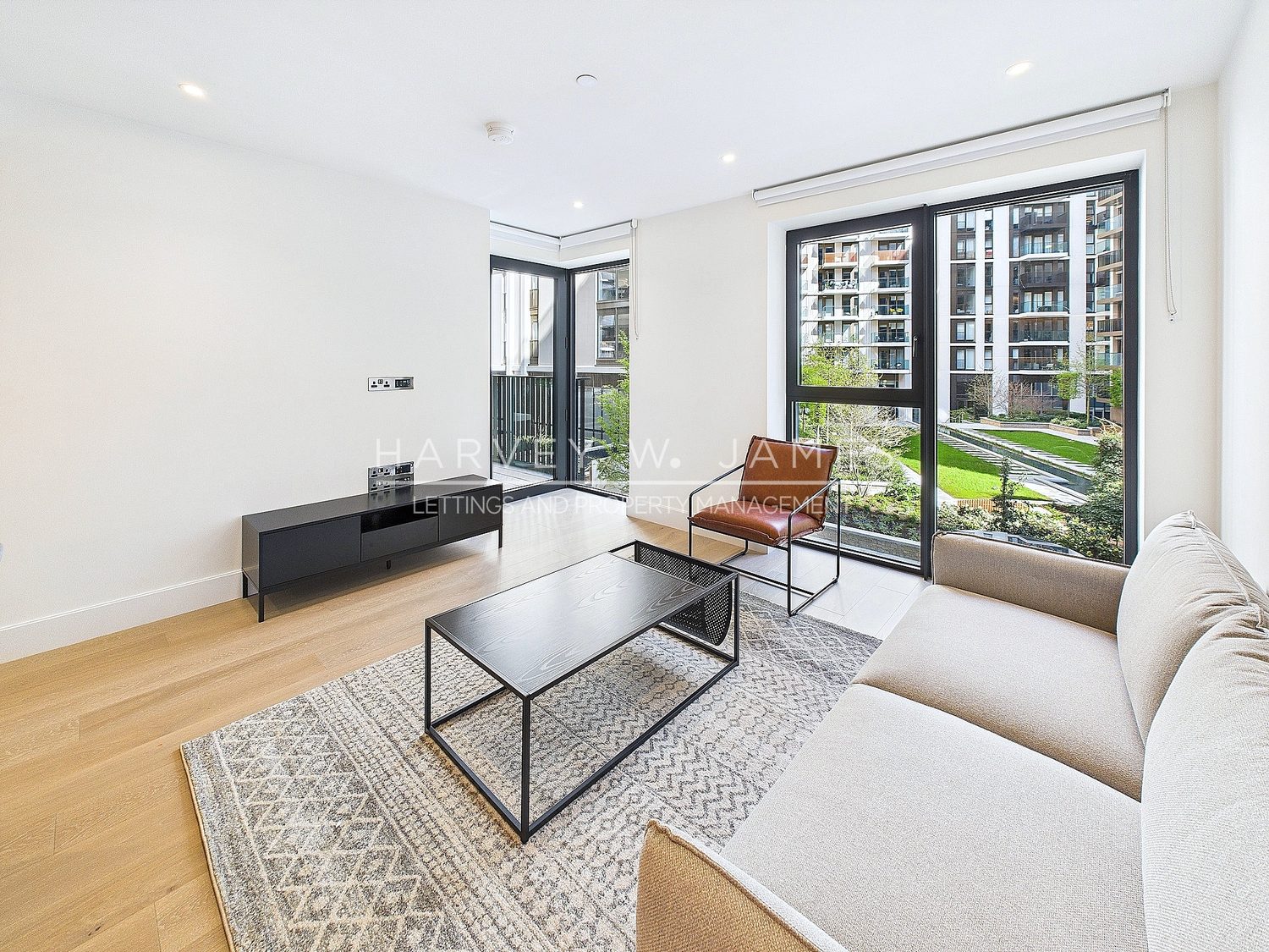 HDR interior photograph showing a balanced room and a clear view through full-height glazing