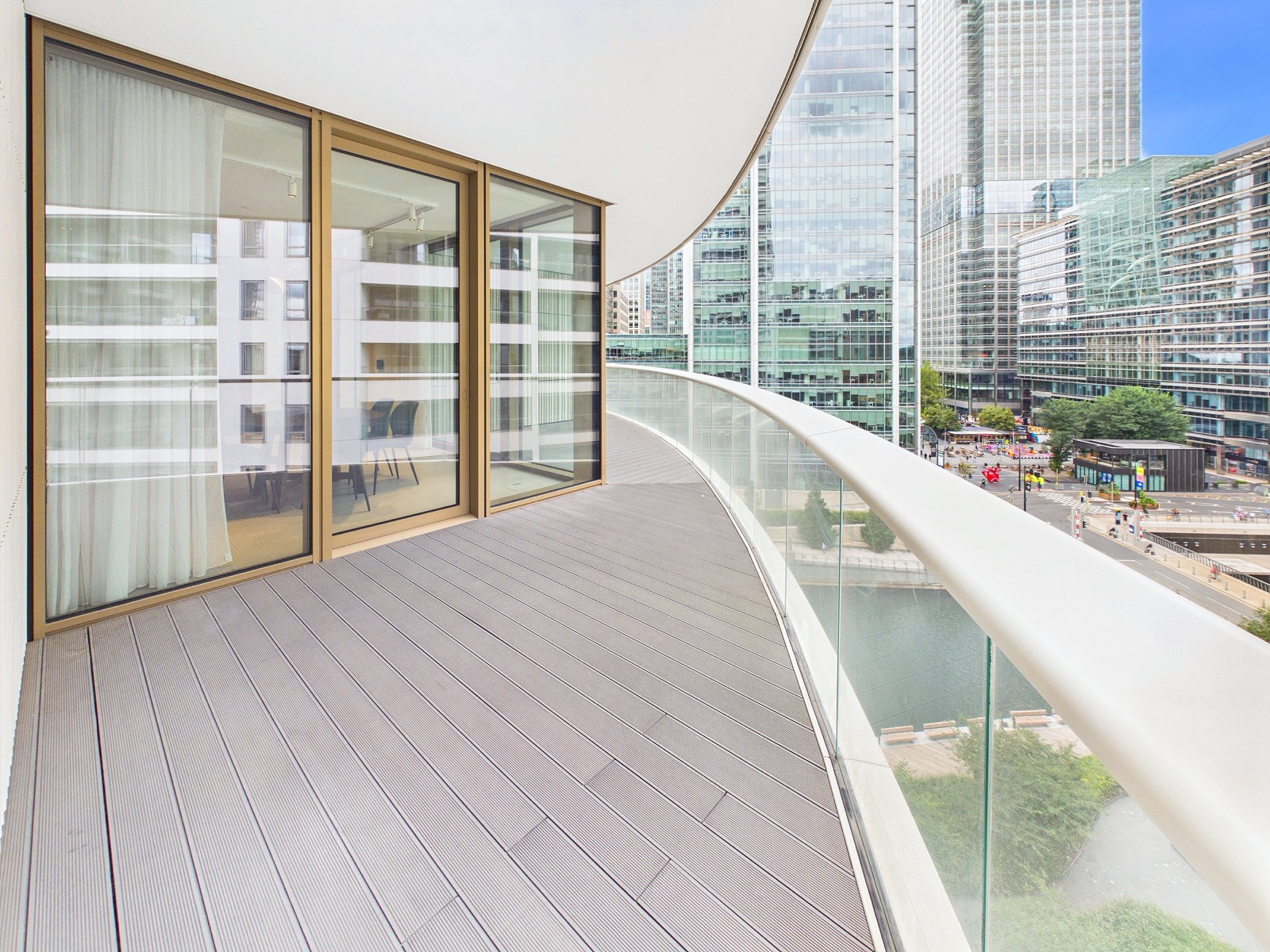 One of five balconies wrapping the curved east elevation — One Park Drive, Wood Wharf