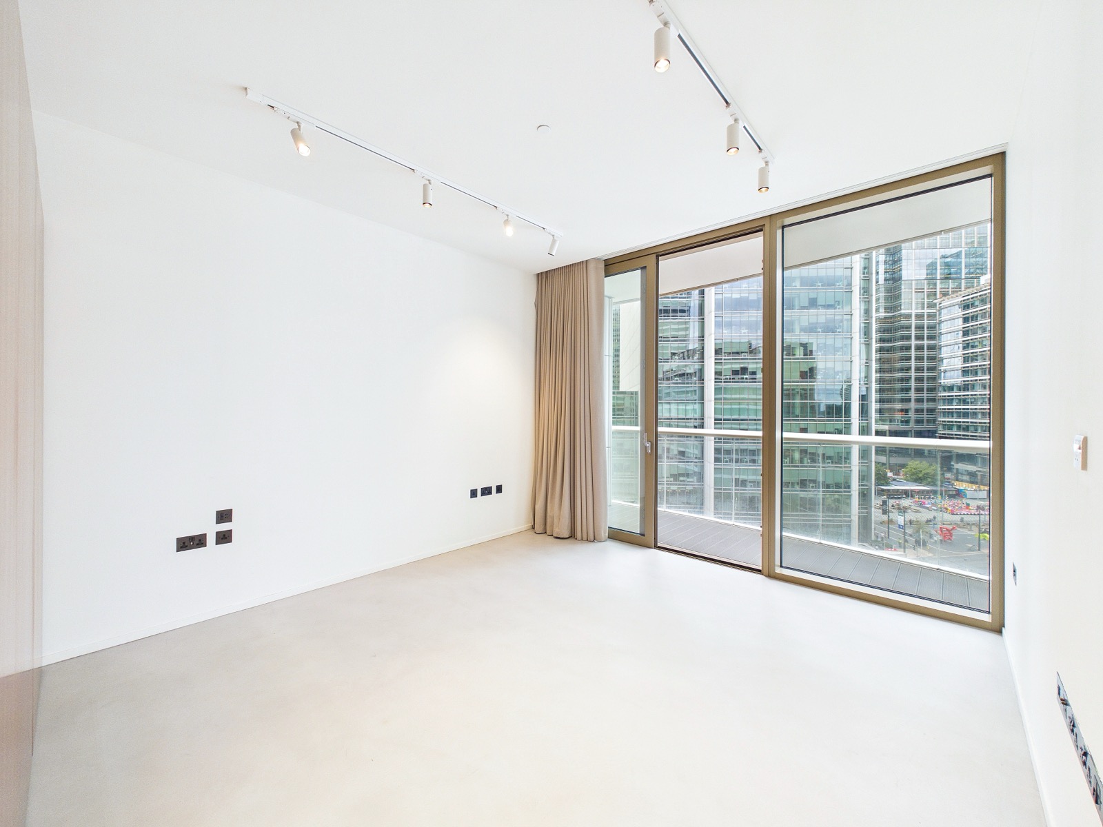 Principal bedroom with full-height glazing — One Park Drive, Wood Wharf