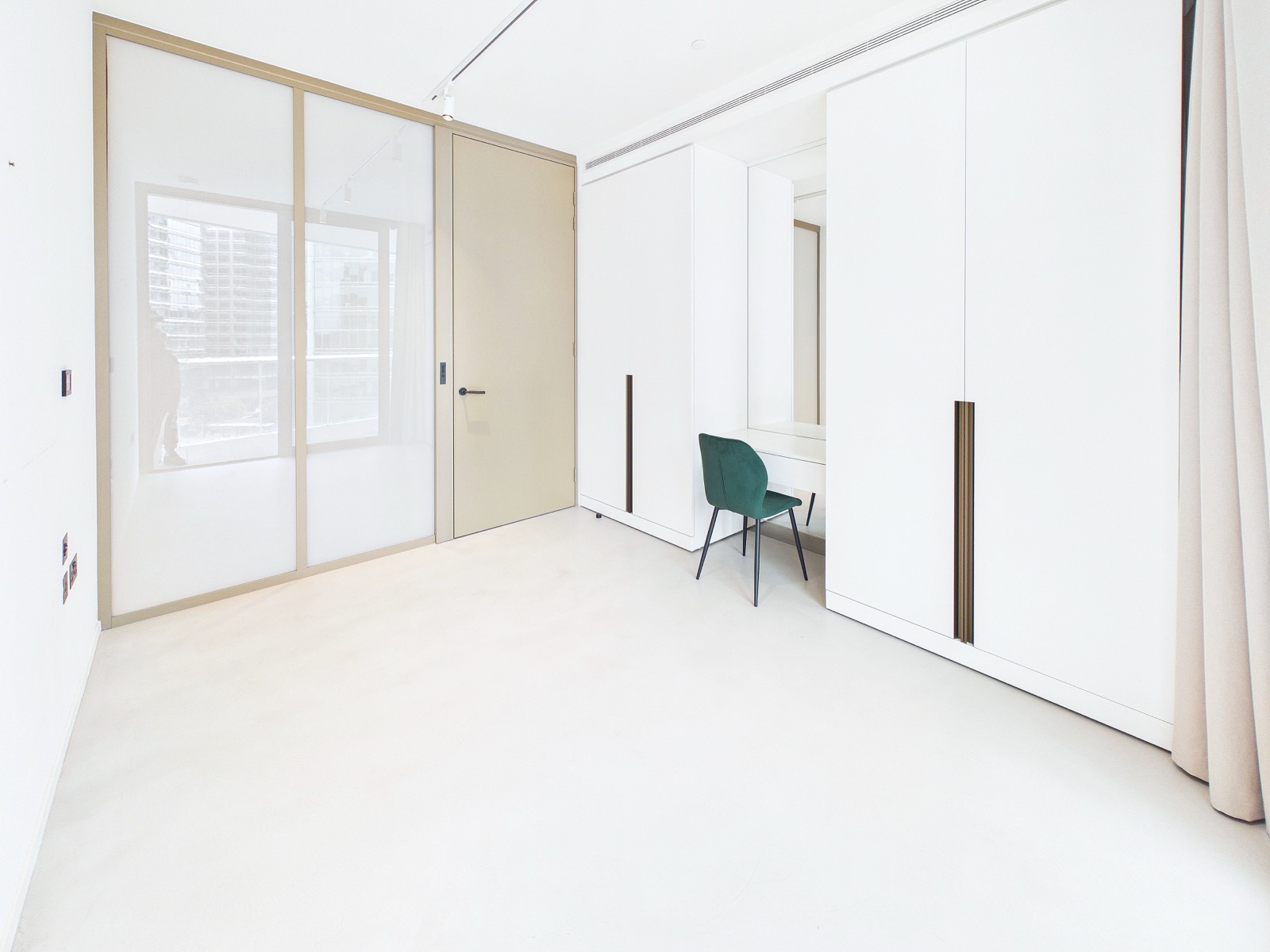 Third bedroom, behind sliding doors off the living space — One Park Drive, Wood Wharf
