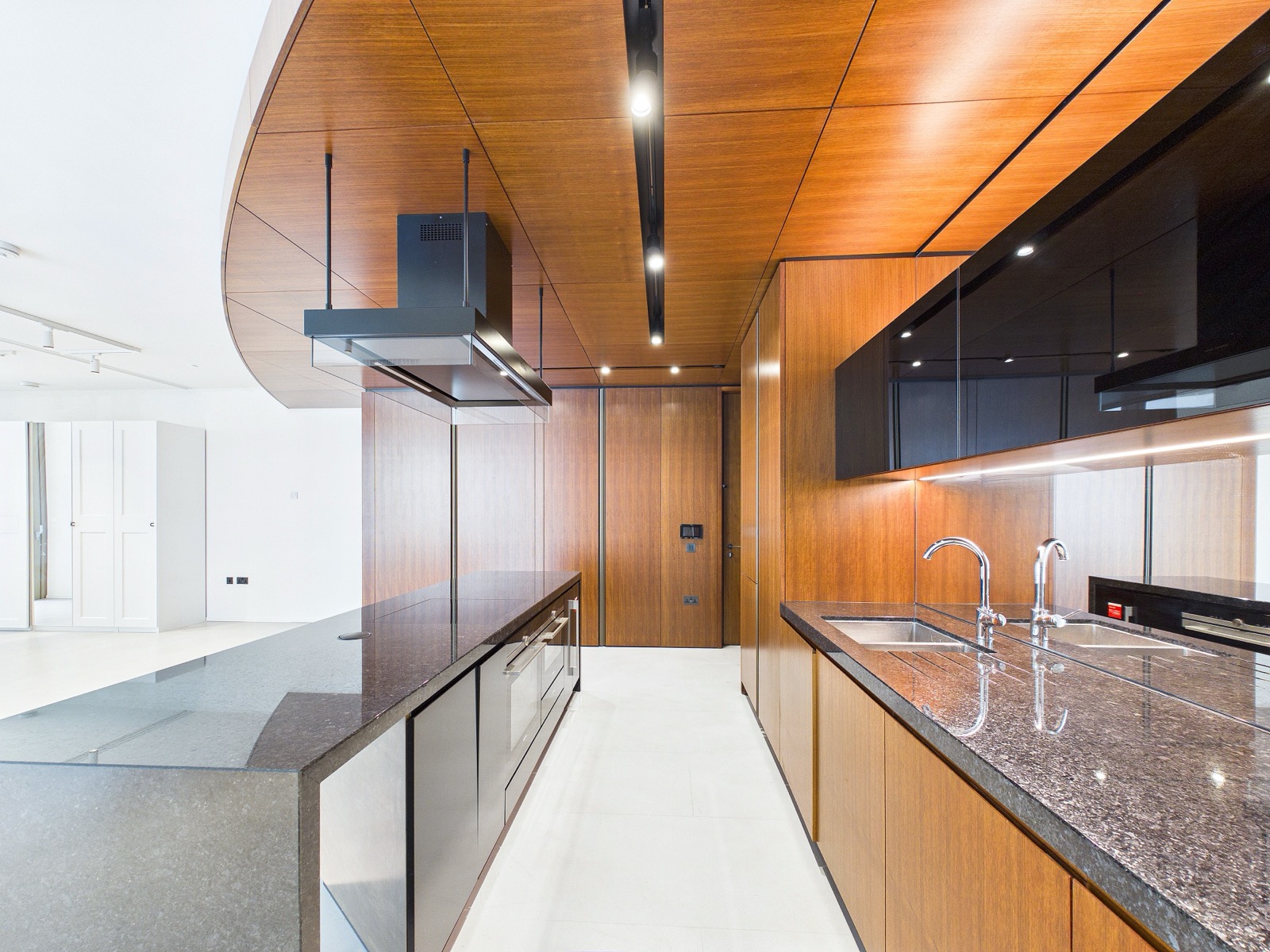 Poliform kitchen with dark stone worktops — One Park Drive, Wood Wharf